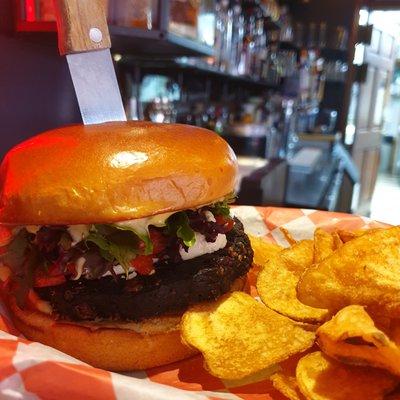 The Cardinal - From our feature menu, our vegetarian friendly black bean burger, paired with peppadews, goat cheese, greens and garlic aioli