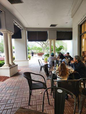 Crocante bakery, cafe covered  Outdoor sidewalk seating.  Great for a rainy day.  It's covered.