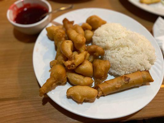 Dinner plate Sweet & Sour chicken with red sauce on the side Sticky rice  instead of fried rice & an egg roll