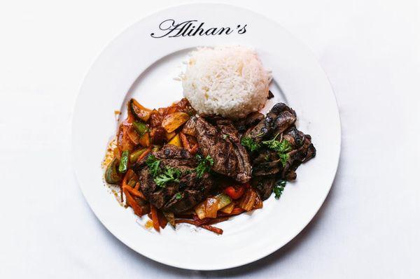 Beef Filet Mignon over sautéed veggies in marinara sauce and with sides of sautéed mushrooms and rice pilav