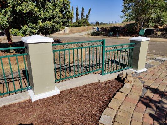 Painted entire columns, fence panels, and cleaned/sealed lower concrete.