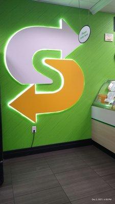 A glowing S for Subway.