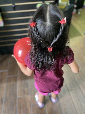 Girls hair cut with butterfly clips