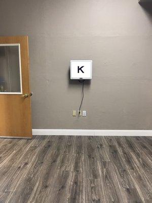 Spacious room with eye chart