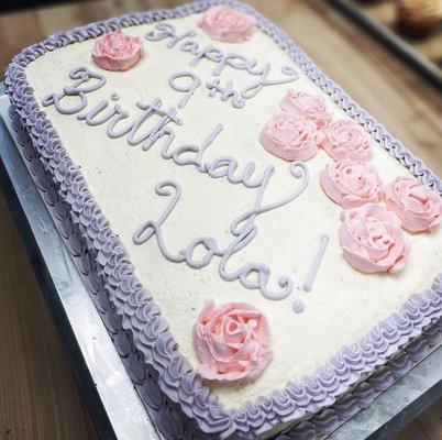 Chocolate cake, vanilla buttercream, pink rosettes