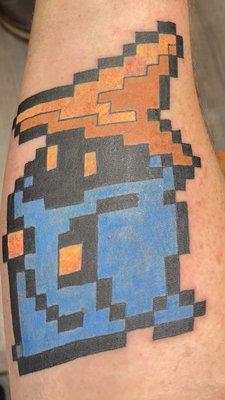 Forearm tattoo of final Fantasy black mage.