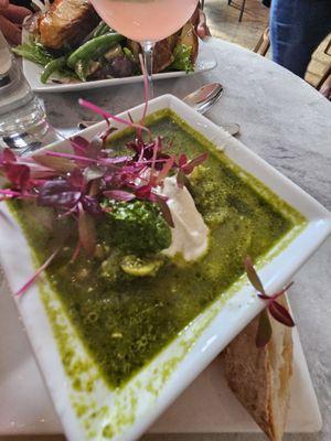 Green minestrone soup topped with cashew pesto