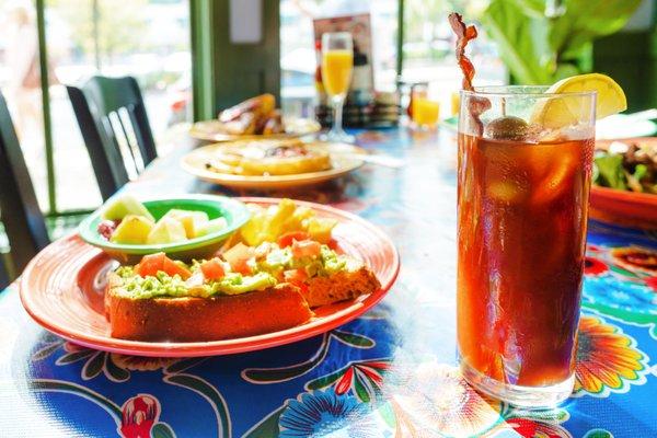 Avocado toast with a Bloody Mary