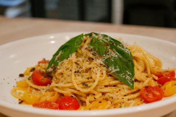 House-made spaghetti with ricotta, sungold tomatoes, basil and parmesan.