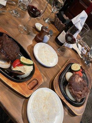 Our dinner, rib eye and filet mignon cooked medium rare.