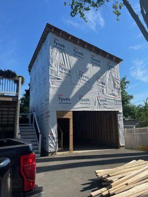 M and Son Contracting building a new garage with a second story.