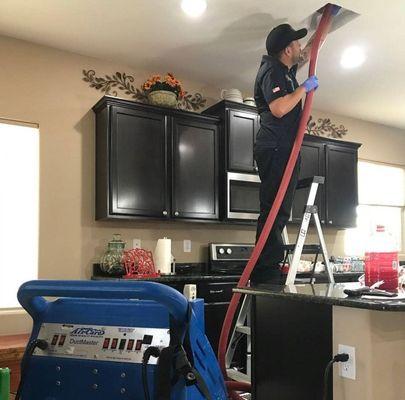 Air duct cleaning Service  process at customers house by Pro chimney and Air duct technician