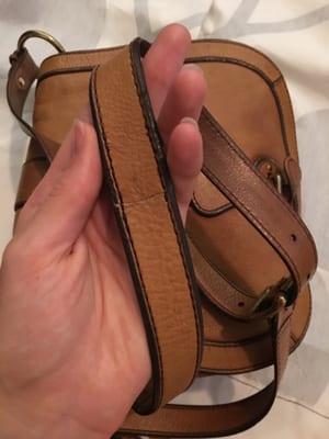 The stitching came apart on the top layer of the strap, so they grafted some leather to cover it.