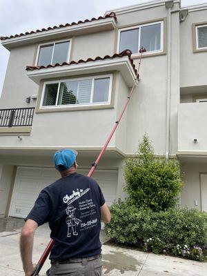 Carlos Sr. In action with our water fed system on this 3 story condo in Huntington Beach.