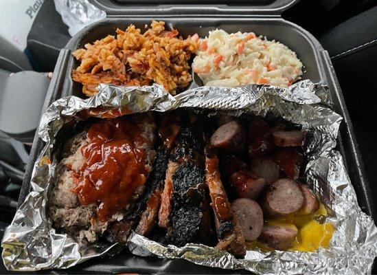 3 Meat plate (pulled pork, brisket, kielbasa) and 2 sides (jambalaya and slaw)