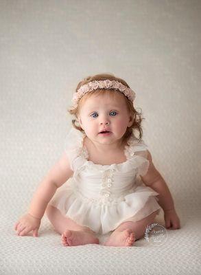 A 4 month old image from her 1st Year Baby Plan milestone session.