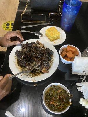 Jerk oxtails greens and yams