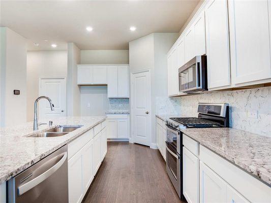 White cabinets and gas stove