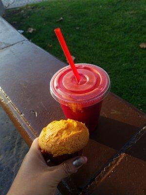 Beets, celery, carrot, and orange juice drink with a cupcake.