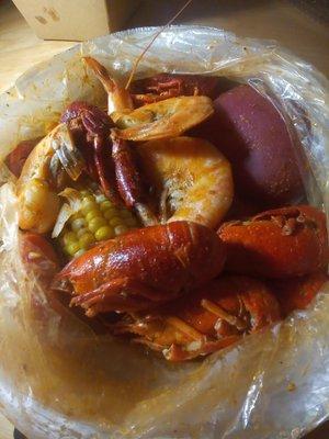 Lunch combo with shrimp and crawfish comes with corn and potato