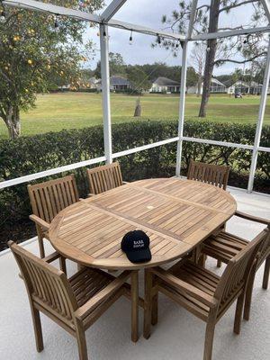 Six piece Teak patio table and chairs.