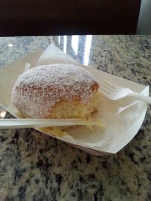 Cream filled donut hole. A bit dry..but tasty. Coconut  flakes on outside.