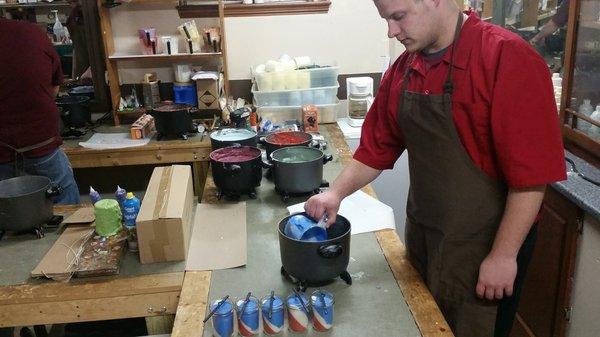 Scott LaMoreaux hand pouring jar candles in our North Ridgeville Store.