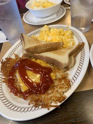 Hash browns and scrambled eggs and toast