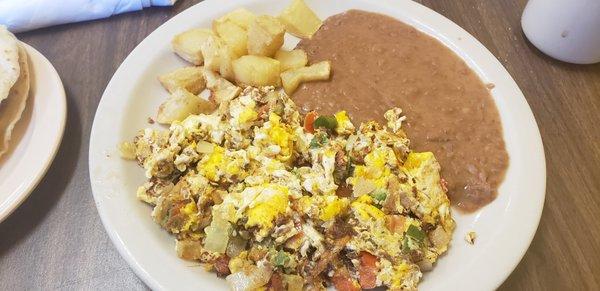 Machacado con nuevo, papas y frijoles. $5.99