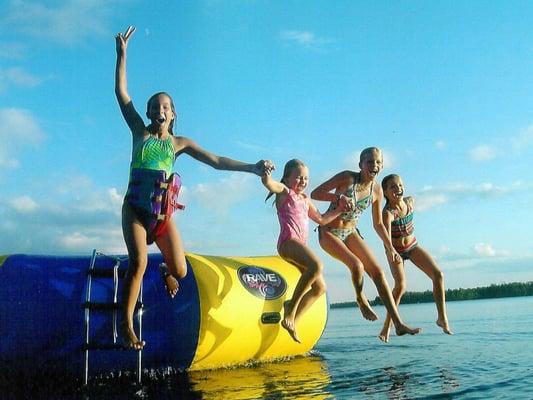 Resort guests enjoy the RAVE trampoline and waterfront activities