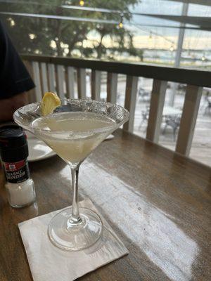 Lemon drop martini with a beautiful porch view.