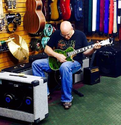 Chris finishing up on one of his creations. This guitar turned out amazing and our customer is in love with it!