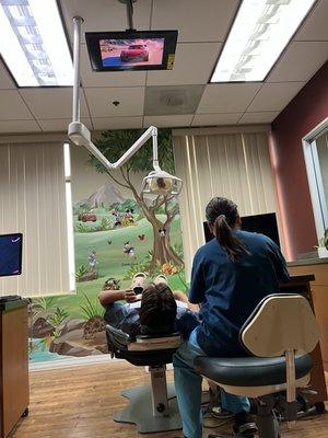 My son watching tv during cleaning