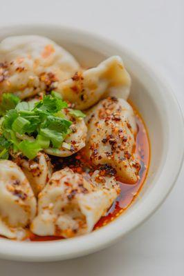 Fresh homemade dumplings in our homemade chili oil. A crowd favorite!