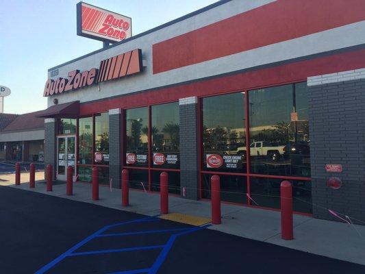 Front of store with freshly paved and striped parking lot.