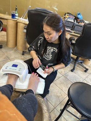 Michelle finishing up my pedicure