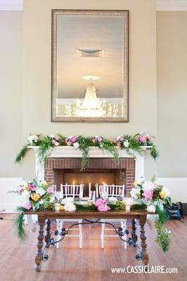 The sweetheart table is gorgeous! Love the fireplace backdrop! :)