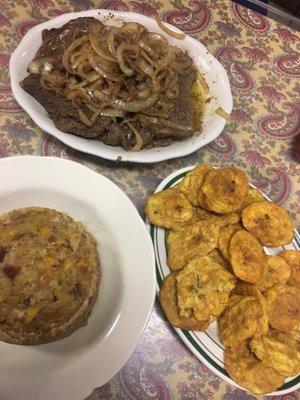 Mofongo, tostones, steak with onions