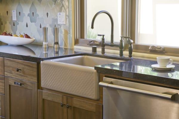 This apron-front kitchen sink by KOHLER features a streamlined and versatile farmhouse style to complement any decor.