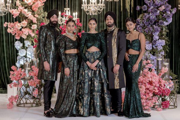 Black, Green and Gold Indian Bridal and Groom Outfits, Perfect for A Regal Reception Look.