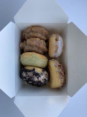 Glazed maple old fashioned, lemon filled, and yeasted matcha, cinnamon, and cookies and cream