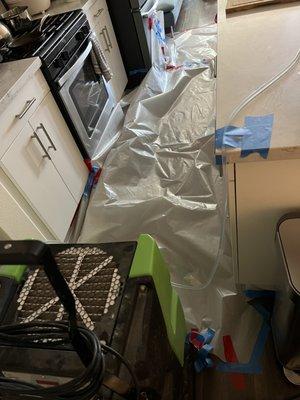 Dehumidifier setup in the kitchen where the flooding happened, as well as downstairs in our garage.