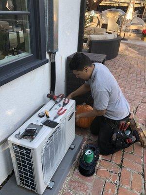 Art is repairing the power feed for a mini split AC unit.