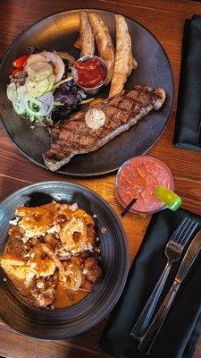 Steak Frites and Shrimp, chorizo, and grit cakes