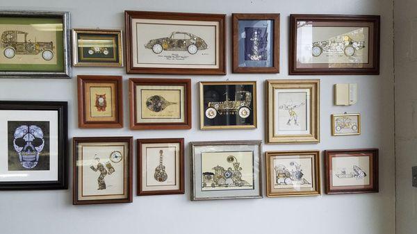 The wonderful wall of watch parts artwork. I like the top right one in corner.. = A Corvette