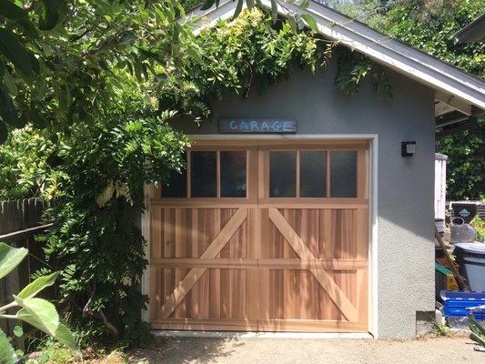 Western red clear cedar sectional door, in metaled in Berkeley (pre-stain)