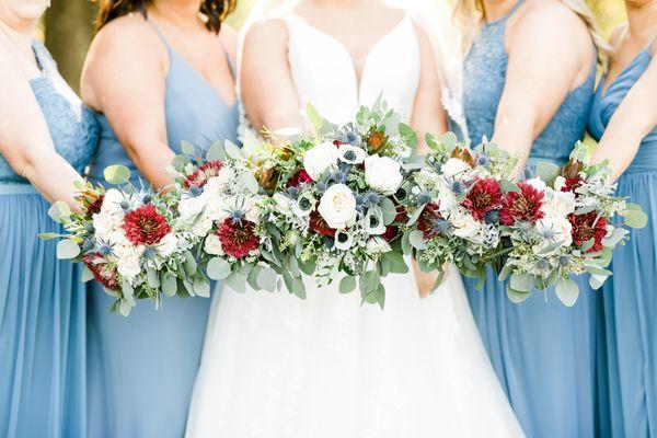 Bridal and bridesmaid bouquets in burgundy, white and blue.  photo from Broad River Photography.