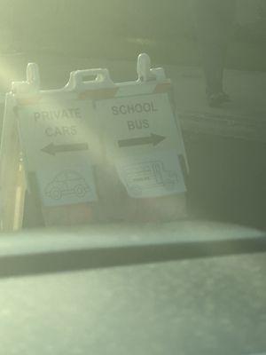 Private cars on LEFT & school buses on RIGHT? What's the point of this - no one listens?? Cars use the bus lane for drop offs everyday