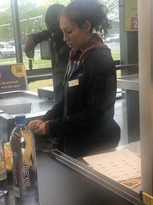 A cashier at The grocery store wishing he would get lost