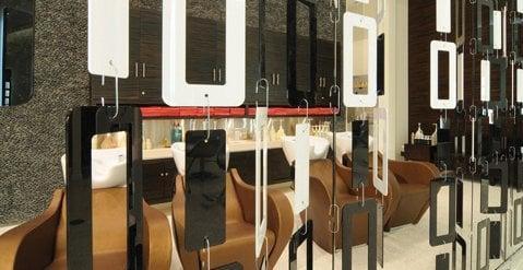 The color bar at award-winning Asha SalonSpa in Rockford is fully stocked with plush chairs and Aveda custom color.